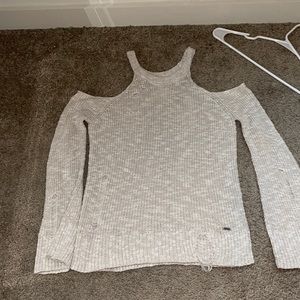 Distressed cold shoulder sweater
